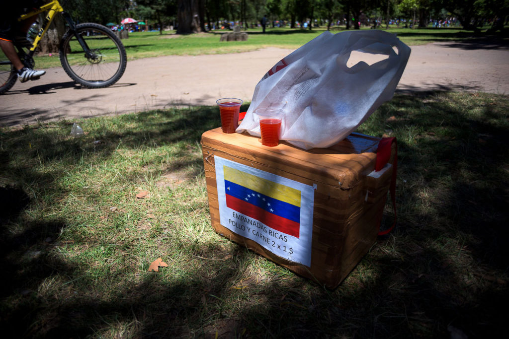 situación laboral migrantes venezolanos Quito Ecuador